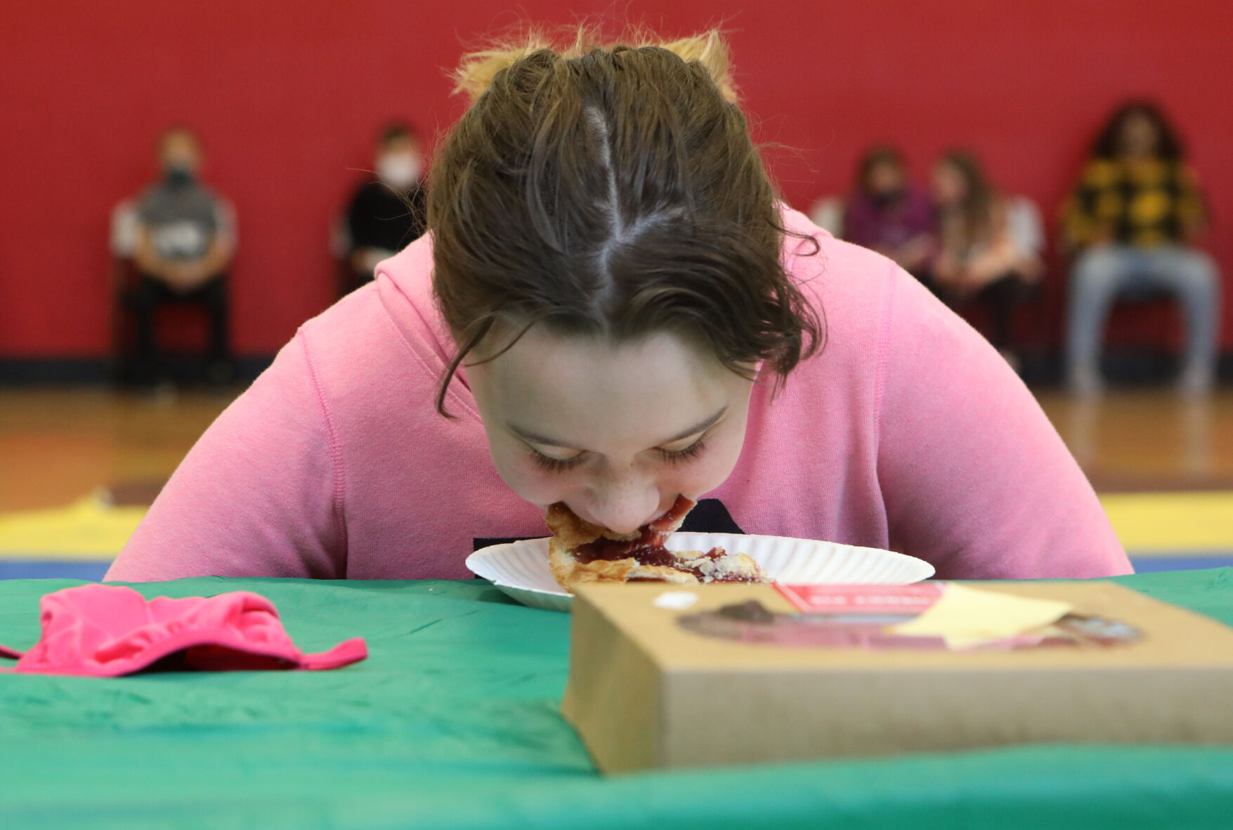 Violet Counts participates in a pie-eating contest